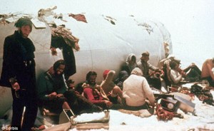 "Survivors: Passengers shelter near the tail of the Uruguayan plane which hit a mountain shrouded in mist as it flew from Santiago to Montevideo."