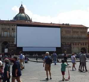A daytime view of the outdoor movie screen on the Piazza Maggiore in Bologna