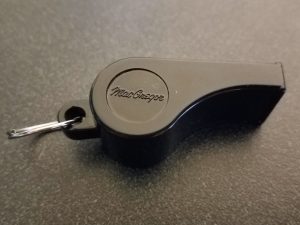 The side of the whistle, with the word "MacGregor" inscribed