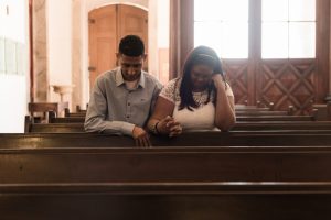 immigrants praying in church