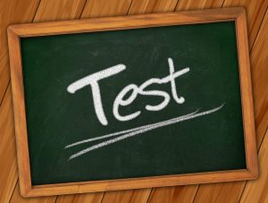 Photograph of chalkboard with the word "test."