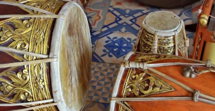 The image shows the drums and instruments that would be played in traditional Javanese gamelan ensemble while dancers are preforming gambyong