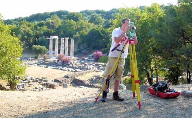 Zachary Domach 13C 13G surveying the topography of the Nike Precinct with the Hieron in the background. Sanctuary of the Great Gods, Samothrace, Greece.