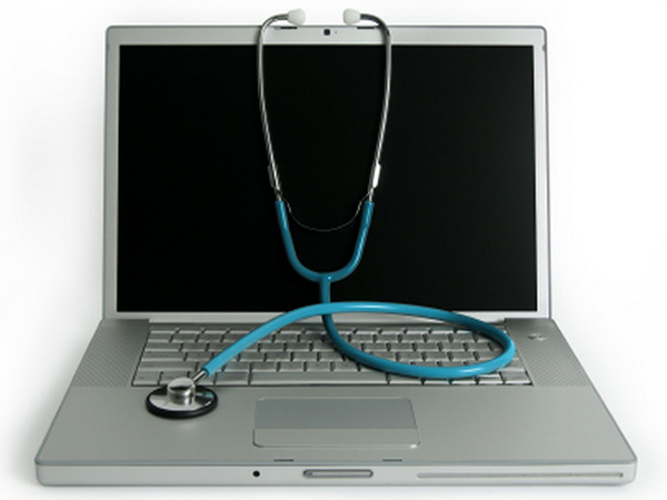 Photo of a laptop and stethoscope