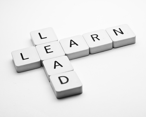 Photo of tiles with the words "Lead" and "Learn"