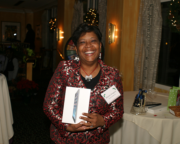 Photo of Sharon Gregory with a prize iPad