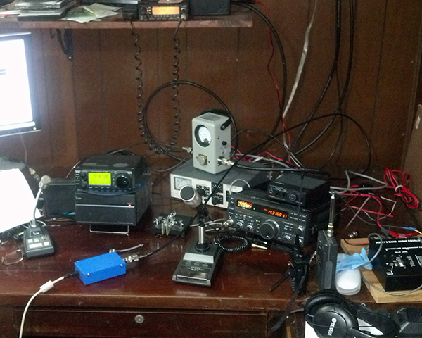 Photo of a ham radio operator's desktop with their equipment