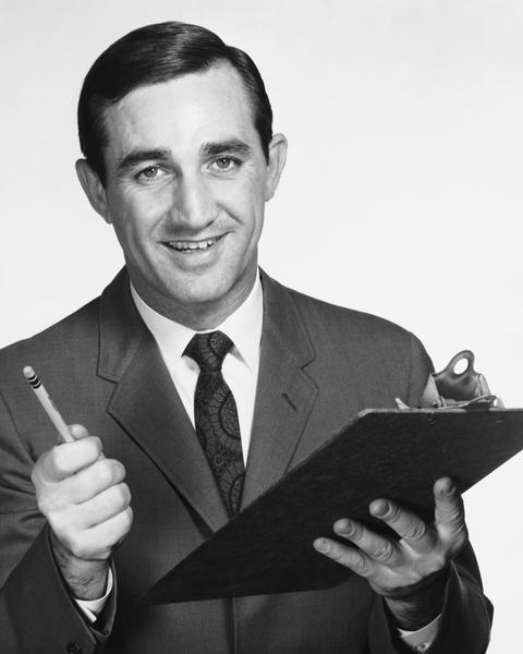 Vintage photo of a man with a clipboard