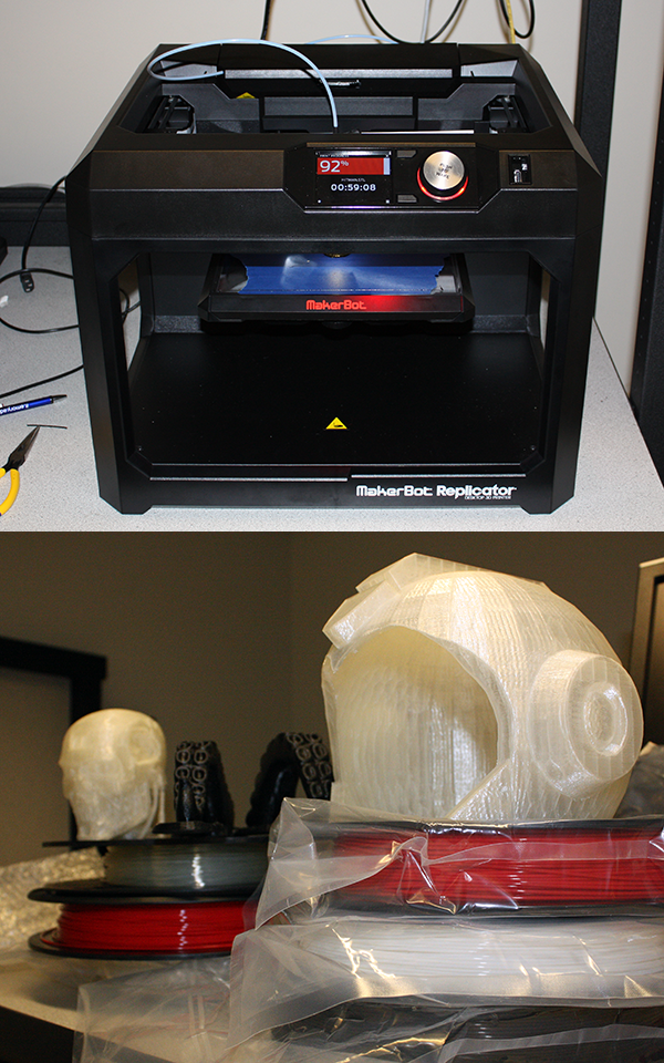Photo of a 3D printer and a couple of printed objects