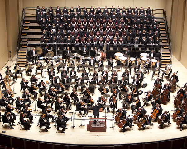 Photo of an orchestral and choral group