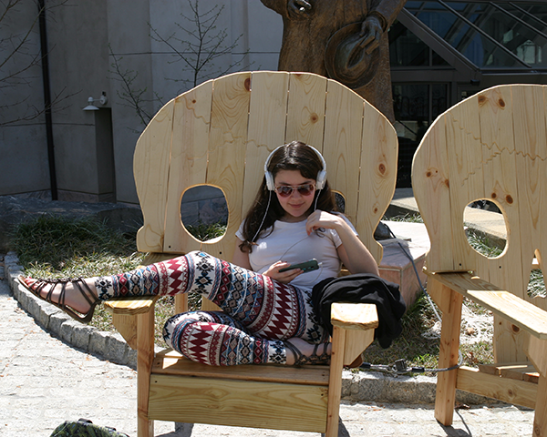 Photo of a student relaxing in a chair
