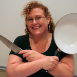 Photo of Christina Mazzella holding cooking implements