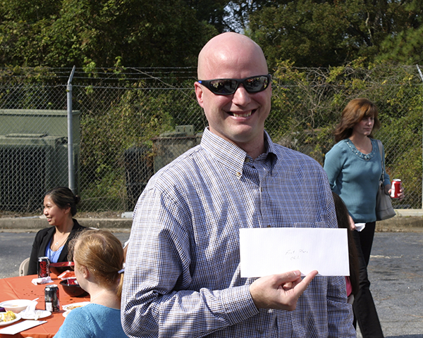 Photo of person receiving award for the best chili