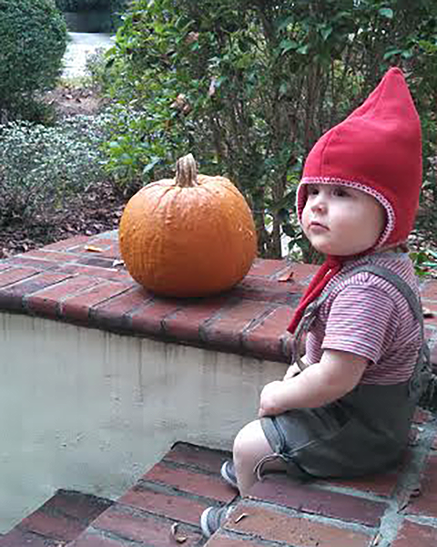 Photo of young child sitting on steps