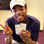 Photo of employee playing cards at a staff party