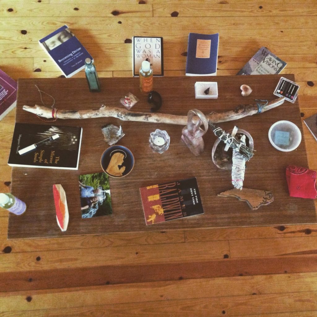 Birds-eye view of a table with small objects and books on it