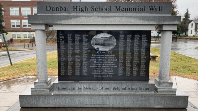 Stone wall monument with list of names commemorating those who taught at Dunbar High School