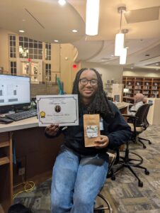 Student employee of the month Maryam Sow with her certificate!