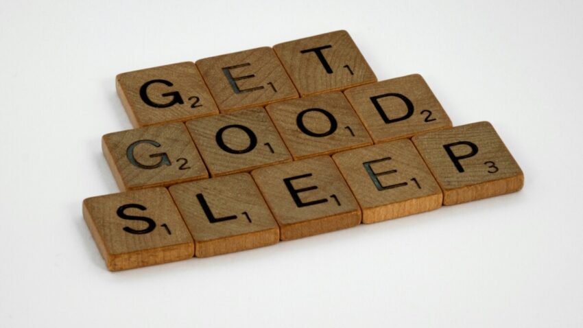 Wooden Scrabble tiles spelling out "Get good sleep"
