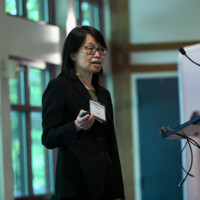 Chunhui Xu, PhD, presenting "Small molecules for cardioprotection" Photo of woman speaking at podium