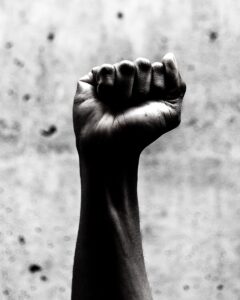 Black and white photograph of a raised fist
