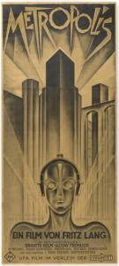 Poster for the film Metropolis, released in 1927. Drawn in an art nouveau style, the image features stylized skyscrapers in the background and shoulders and head of a humanoid robotic figure in the foreground.