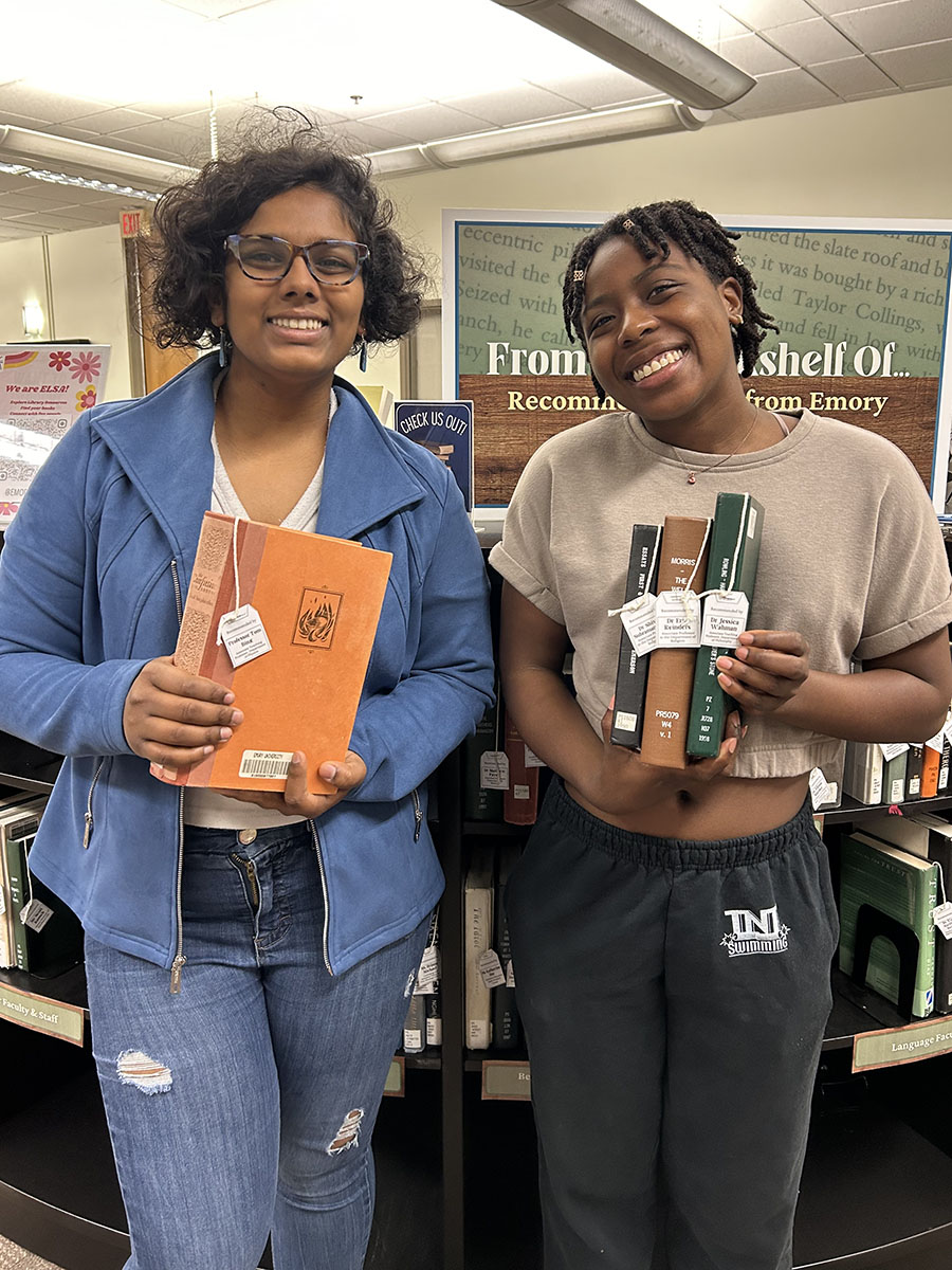 ELSA members holding up books