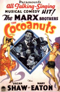 A full color image featuring the theatrical release of the Marx Brothers film "The Cocoanuts." The text reads "Paramount's all talking-singing musical comedy hit! The Marx brothers in The Cocoanuts. With Oscar Shaw and Mary Eaton."