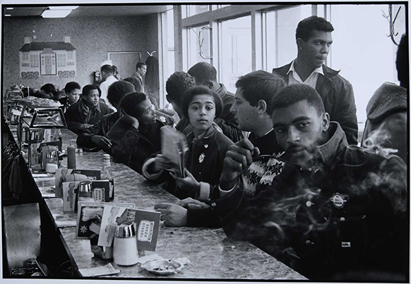 Staff of the Student Nonviolent Coordinating Committee hold a sit-in demonstration at the lunch counter of the Toddle House, 1963. Photo by Danny Lyon.