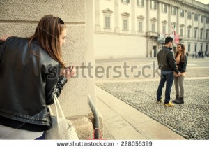stock-photo-stalking-ex-girlfriend-spying-her-ex-boyfriend-with-another-woman-stalking-infidelity-and-228055399
